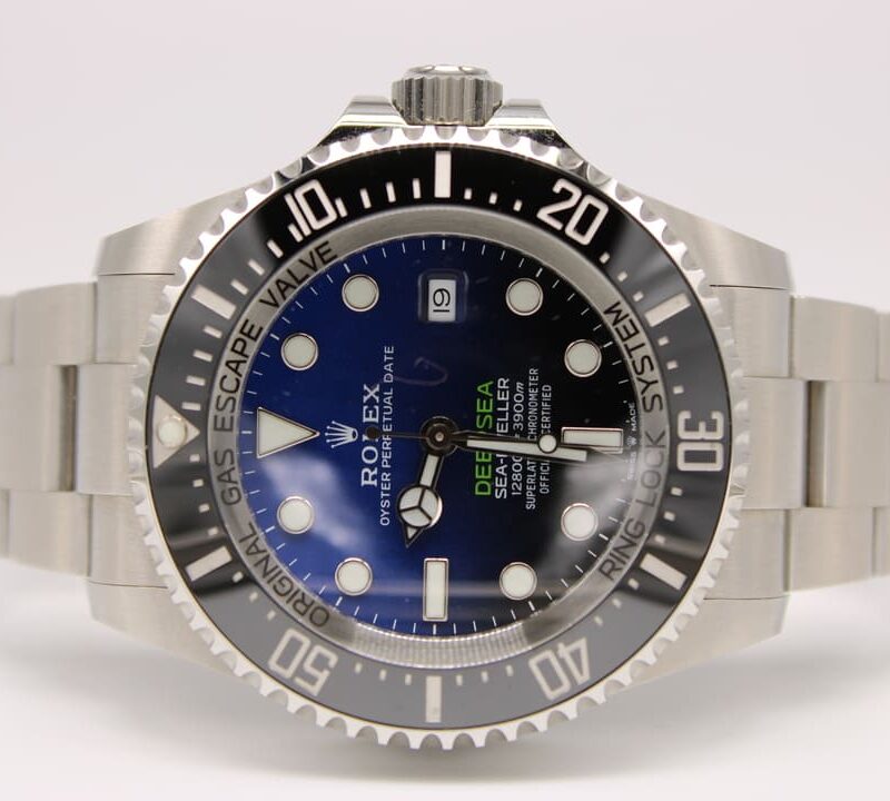 Stainless steel Rolex Deepsea diving watch with blue dial and unidirectional bezel on a metal bracelet at a slight angle.