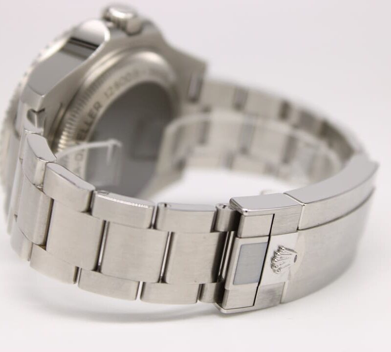 Silver stainless steel wristwatch with a link bracelet, showing the clasp with a Rolex crown emblem.